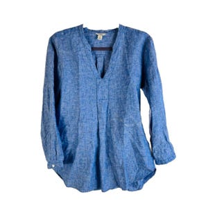 May include: A blue linen long-sleeved shirt with a v-neck and a relaxed fit.