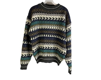 May include: A striped sweater with a crew neck and long sleeves. The sweater has a pattern of brown, white, blue, and green stripes with geometric designs.