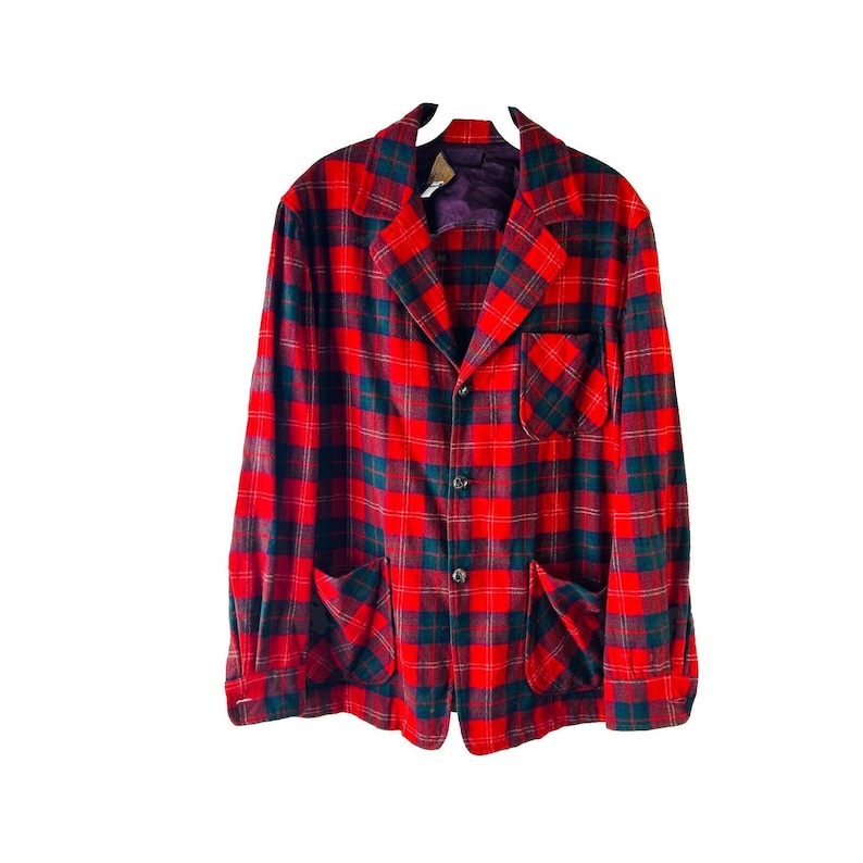 May include: A red and black plaid blazer with a button closure and two large pockets.