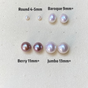 May include: An assortment of pearls in various sizes and shapes, including round 4-5mm, baroque 9mm+, berry 11mm+, and jumbo 13mm+. The pearls are displayed on a light-colored surface, with text labels indicating their type and size.