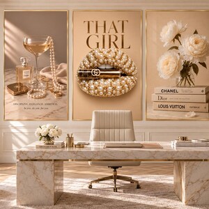 May include: A home office featuring a marble desk, a cream chair, and three large wall art prints. The left print shows a perfume bottle, pearls, and a glass. The center print displays lips covered in pearls with the text THAT GIRL. The right print shows flowers and books labeled Chanel, Dior, and Louis Vuitton.