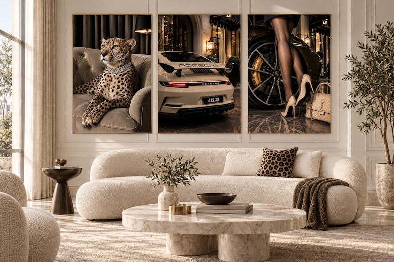 May include: A triptych wall art set featuring a cheetah on a tufted sofa, the rear view of a white Porsche sports car, and a pair of legs in sheer black stockings wearing high heels next to a luxury handbag, displayed above a curved cream sofa.