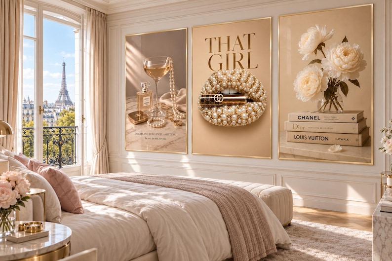 May include: A set of three framed wall art prints displayed above a bed. The left print shows perfume, a glass, and pearls. The center print features lips covered in pearls with the text THAT GIRL and a lipstick. The right print shows white peonies.