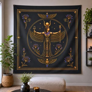 May include: A black wall tapestry featuring a central gold and blue illustration of an Egyptian deity with wings, holding an ankh and a scepter. The design includes lotus flowers, a winged scarab, and a winged sun disk within a circular frame.