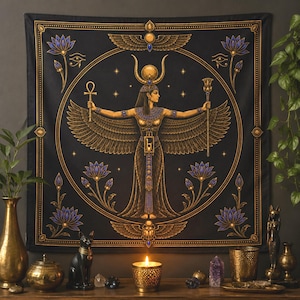 May include: A square black wall tapestry featuring a central golden illustration of a winged deity with a horned headdress, holding an ankh and a scepter. The design is framed by a circular border, blue lotus flowers, and small stars on a dark background.