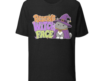 Camiseta unisex de Halloween con diseño de gato y cara de bruja en reposo