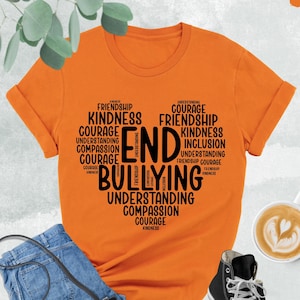 May include: Orange t-shirt with a black word cloud design that says "End Bullying". The word cloud includes words like "friendship", "kindness", "courage", "understanding", and "compassion".
