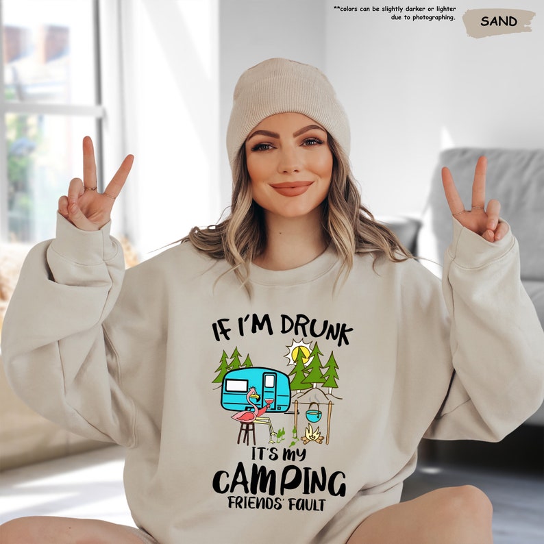 a woman wearing a sweatshirt that says if i'm drunk it's my