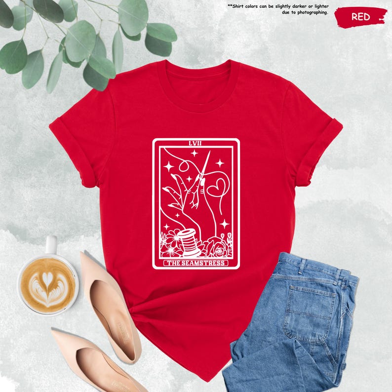 a red t - shirt with a picture of a woman holding a cup of coffee