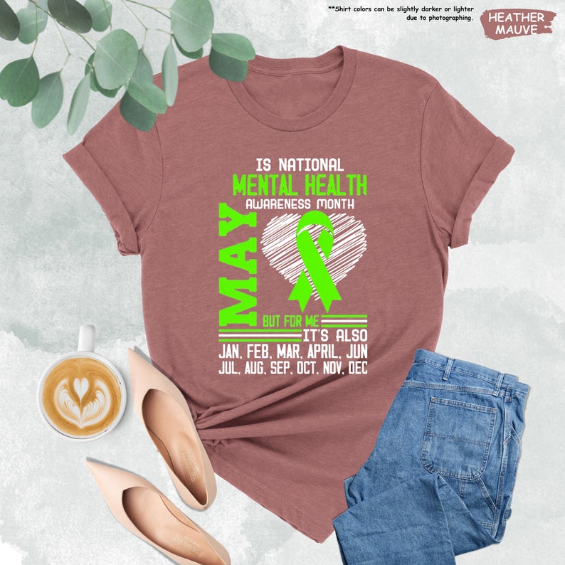a t - shirt with a green ribbon and a cup of coffee