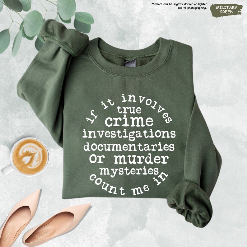 a green sweatshirt with a quote on it