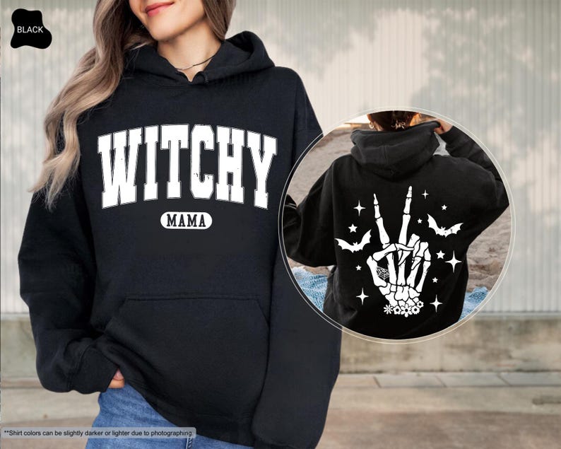 a woman wearing a black witch hoodie and a black sweatshirt