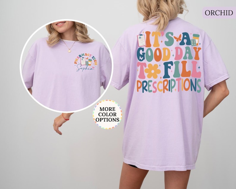 May include: Orchid-coloured t-shirt with the text "IT'S A GOOD DAY TO FILL PRESCRIPTIONS" on the back. The front of the shirt has a pharmacy tech logo and the name "Sophia". The shirt is a comfortable, casual style.