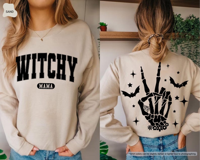 a woman wearing a sweater with a witch hand on it