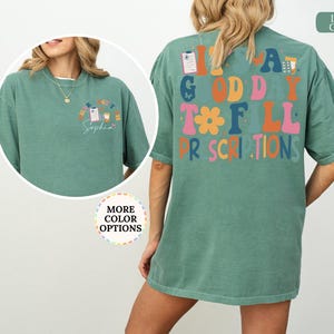 May include: Light green t-shirt featuring the text "It's a Good Day to Fill Prescriptions" in various colours on the back. The front has a smaller design with pharmacy graphics and the name "Sophia".