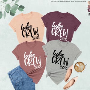 May include: Four t-shirts with the text "tube crew 2025" in black and white. The shirts are in different colors: peach, maroon, heather grey, and athletic heather.