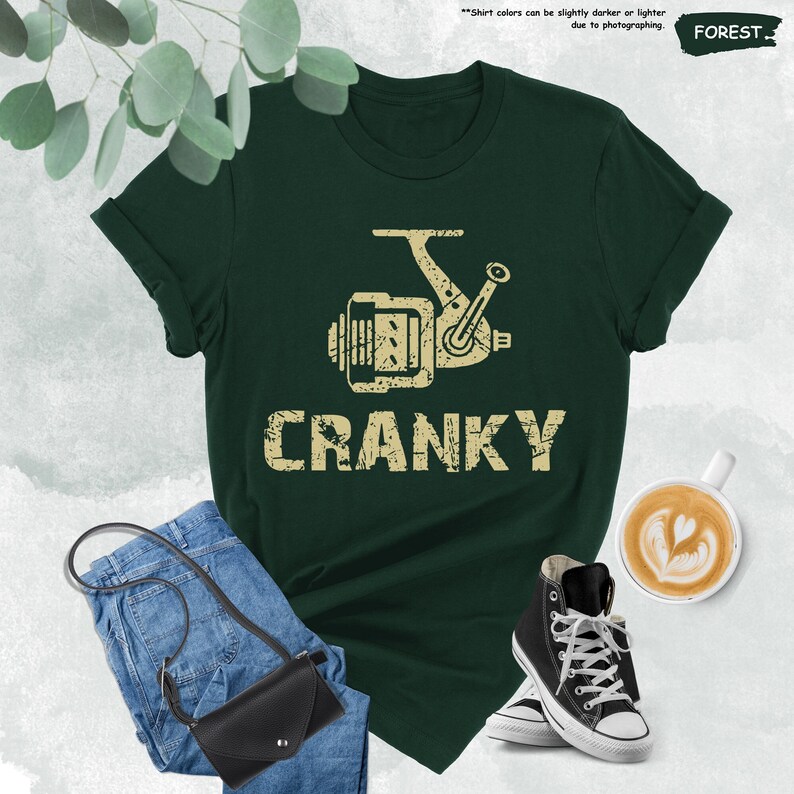 a t - shirt with the words cranky on it next to a pair of