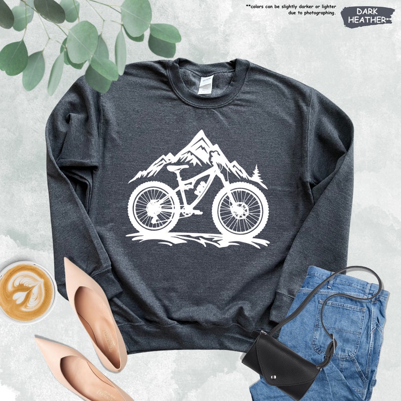 a black sweatshirt with a mountain bike on it