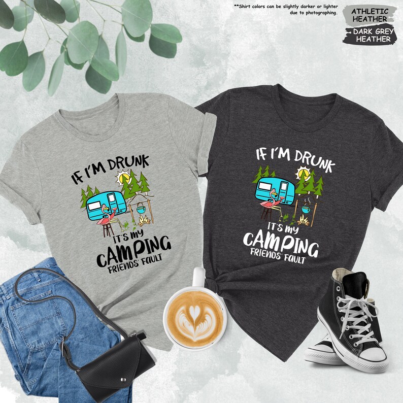 a couple of shirts that are next to a cup of coffee