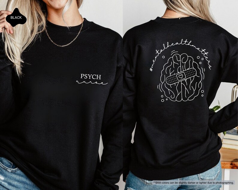 a woman wearing a black sweatshirt with the words psychic on it