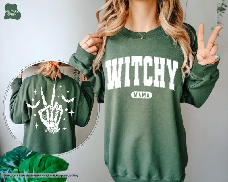 a woman wearing a green sweatshirt with the words witch on it