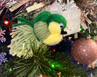 Handmade thread bird with top rope for easy hanging. Green and yellow parrot to decorate your home. Tree ornament.