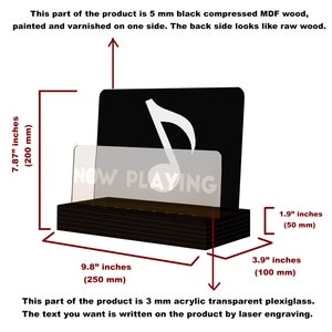 May include: A black wooden display stand with a white musical note and the text "NOW PLAYING" on a clear acrylic panel. The stand is 9.8 inches wide, 7.87 inches tall, and 3.9 inches deep.