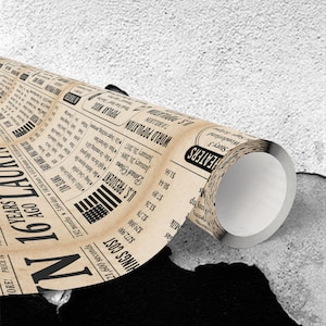 May include: A rolled-up newspaper print with black text on a beige background. Headlines include "16 Years Ago" and "Things Cost." Sections detail "U.S. President" and "World Population."