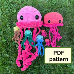 May include: A crochet pattern for making a family of jellyfish. The pattern includes instructions for making a large pink jellyfish, a smaller red jellyfish, and several smaller jellyfish in various colors. The pattern is available as a PDF download.