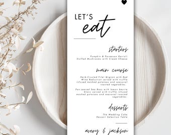 Puede incluir: Un menú de boda con el título "LET'S eat" en fuente cursiva negra. El menú enumera los entrantes, el plato principal y los postres para la recepción de boda de Avery & Jackson el 30 de junio.