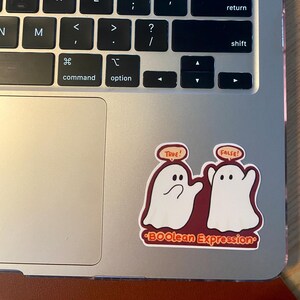 May include: A sticker featuring two cartoon ghosts, one labelled "TRUE!" and the other "FALSE!" on a burgundy background. The text "BOOlean Expression" is below the ghosts.