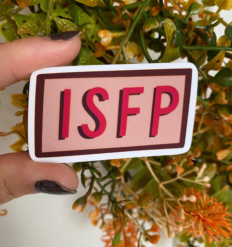 May include: A white sticker with a brown border and a pink background. The text "ISFP" is written in red with a 3D effect.