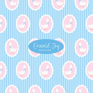 May include: A repeating pattern featuring white geese with blue bows inside pink oval frames with white scalloped edges. The background has vertical blue and white stripes. The text "Emerald Joy DESIGNS" is in a blue oval.