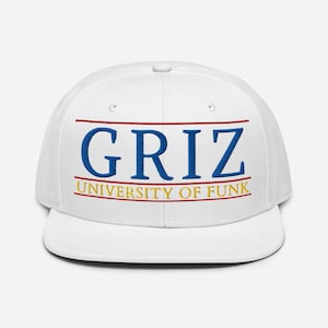 May include: White baseball cap with the word "GRIZ" in blue block letters, with a red line above and a red line below. Below the word "GRIZ" is the text "UNIVERSITY OF FUNK" in yellow block letters.