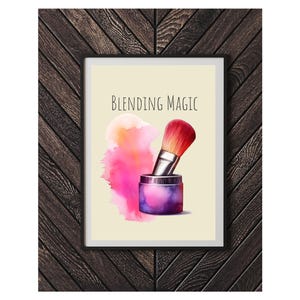 May include: A watercolor illustration of a makeup brush and a jar of makeup powder with a pink and orange watercolor background. The text "BLENDING MAGIC" is written in black above the brush and jar.
