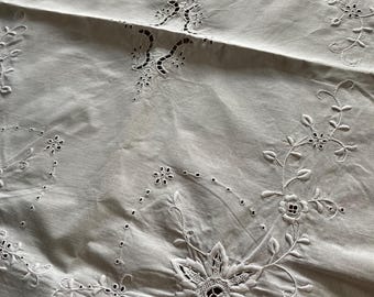 Magnificent antique white linen hand embroidered floral tray cloth with eyelet work, French knots and scalloped edges. Heirloom linen.