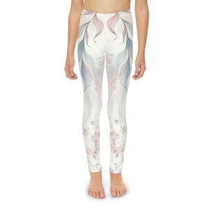 May include: White leggings with a watercolor floral print in shades of pink, blue, and green.