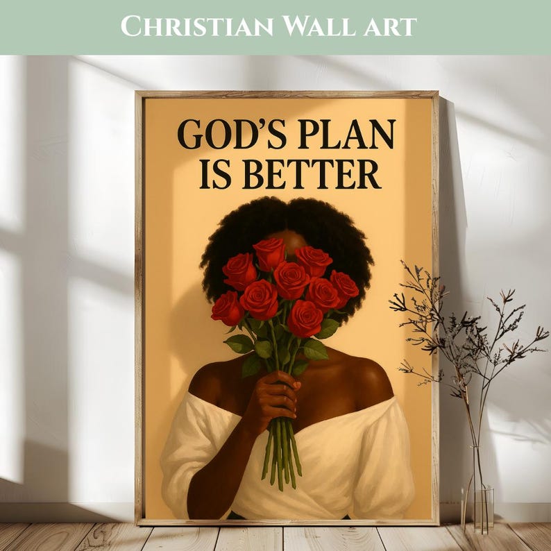 May include: Christian wall art print featuring a woman holding a bouquet of red roses, with the text "GOD'S PLAN IS BETTER" in black. The artwork has a warm color palette and is framed in a wooden frame.