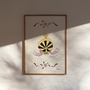 May include: A framed artwork featuring a whimsical perfume bottle design. The bottle is yellow and black, with a pink and white scarf. The word "PARFUM" is written below the bottle. Decorative floral elements and a wooden frame complete the piece.
