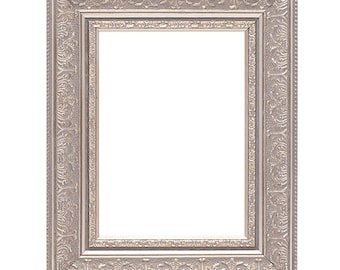 May include: A silver picture frame with an ornate design. The frame has a raised edge and a smooth, polished finish.
