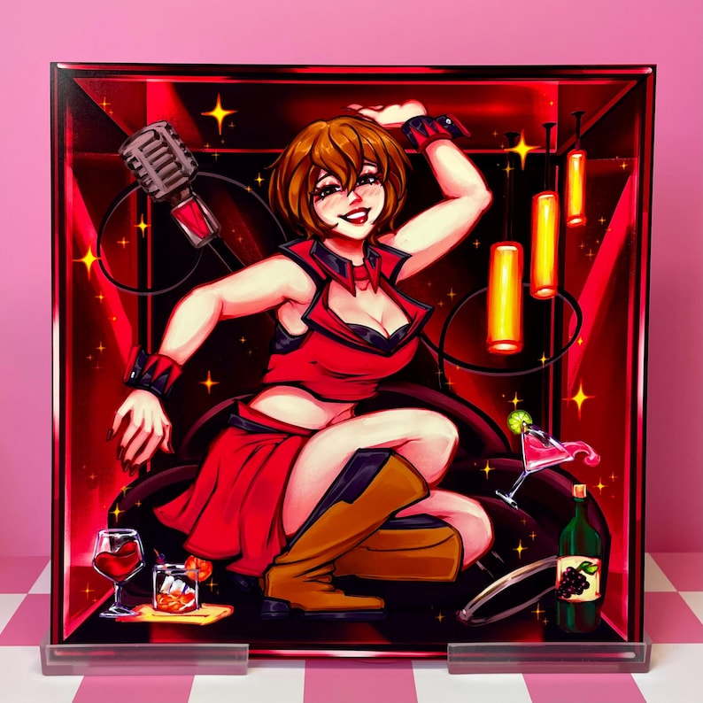May include: A framed illustration of a woman in a red outfit, posed in a cabaret setting. The artwork features a microphone, cocktails, and a bottle of wine. The background is a deep red with yellow accents.
