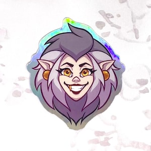 May include: A holographic sticker featuring a cartoon illustration of a purple-haired woman with yellow eyes and a mischievous grin. She has pointed ears and wears gold earrings.