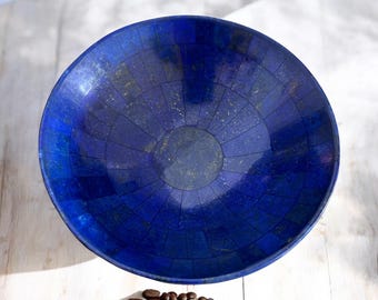 May include: A blue lapis lazuli bowl with a geometric pattern. The bowl is made of natural stone and has a shiny finish.