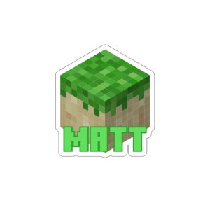 May include: A green and brown Minecraft-style block with the name "MATT" printed below it.