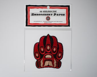 May include: Red and black embroidered patch of a bear paw with the text "Golden Top Embroidery Patch" on a white card.