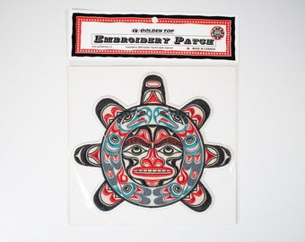 May include: Embroidered patch featuring a stylized sun with a face and a design of birds and waves in red, blue, black, and white. The patch is on a white background and has a label that reads "Golden Top Embroidery Patch".