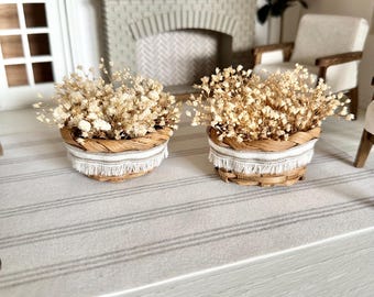Dollhouse miniature basket full of dried baby’s breath flowers with neutral fabric fringe