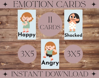 May include: A set of 11 emotion cards featuring cartoon illustrations of people expressing different emotions. The cards are designed for children and are perfect for teaching emotional literacy. The emotions depicted include happy, shocked, and angry. The cards are arranged in a 3x5 grid on a wooden background.