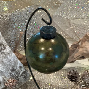 This gorgeous 3.75 inch Christmas ball done in green, browns, bronze and gold