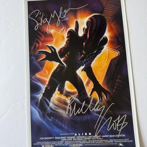 Póster de película firmado por Sigourney Weaver y Ridley Scott (código de autenticidad)